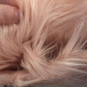 Pink furry small area rug